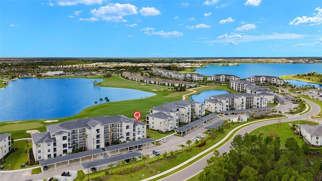 aerial view with view of golf course and a water view