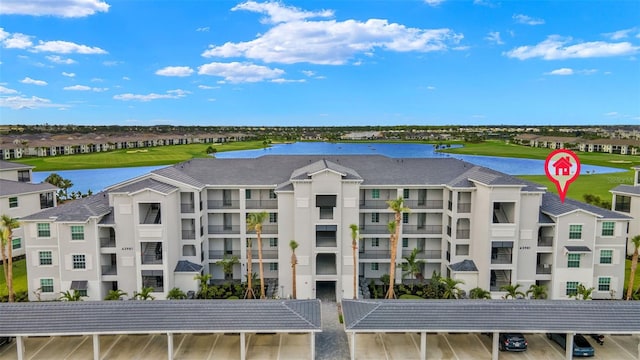 view of property featuring a water view and view of golf course