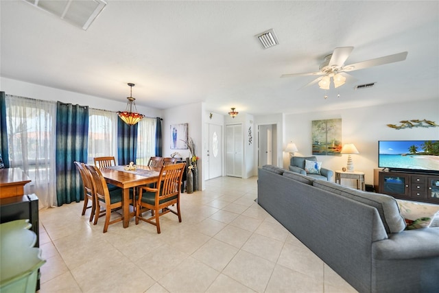 tiled dining room with ceiling fan