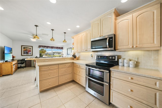 kitchen with kitchen peninsula, light brown cabinetry, and stainless steel appliances