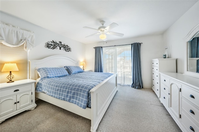 bedroom with ceiling fan and light carpet