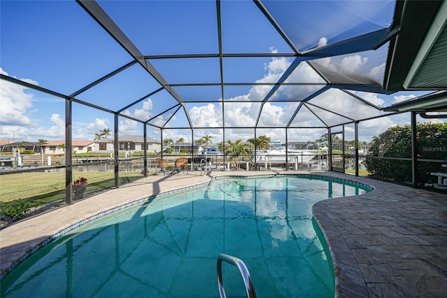 view of pool with a lanai and a patio