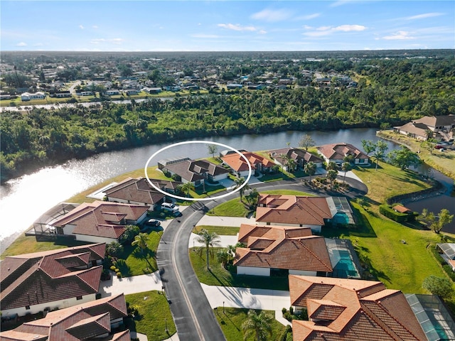 birds eye view of property featuring a water view