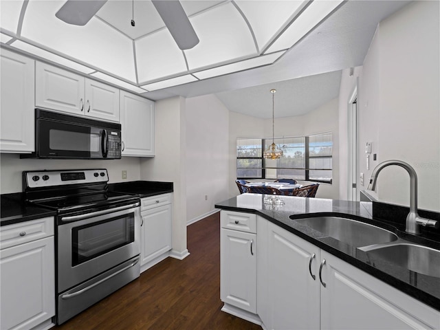 kitchen featuring sink, dark wood-type flooring, stainless steel range with electric cooktop, white cabinets, and ceiling fan with notable chandelier