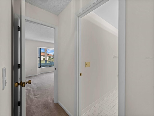 1946 Cove Pointe Dr, Venice, FL 34293 - hall featuring a textured ceiling and carpet floors