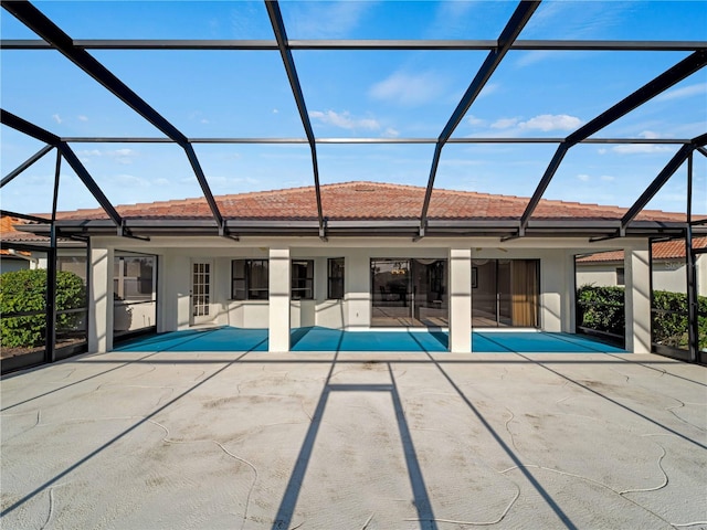 view of pool featuring a patio area and glass enclosure