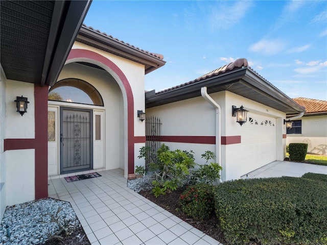 view of exterior entry featuring a garage