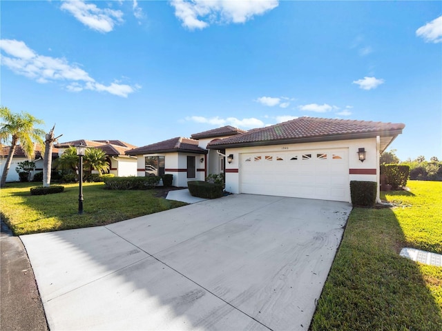 single story home with a garage and a front lawn