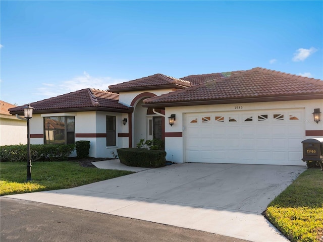 1946 Cove Pointe Dr, Venice, FL 34293 - mediterranean / spanish-style house with a garage, stucco siding, driveway, a tiled roof, and a front yard