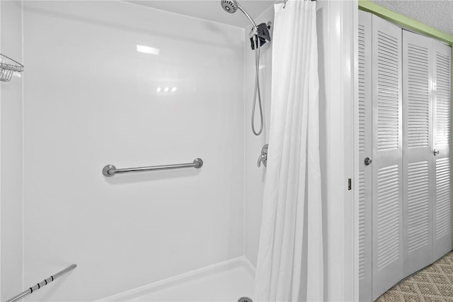 bathroom featuring walk in shower