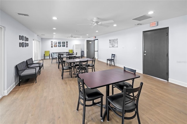 dining area featuring light hardwood / wood-style flooring and ceiling fan