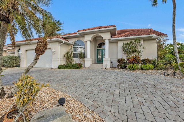 mediterranean / spanish-style house featuring a garage