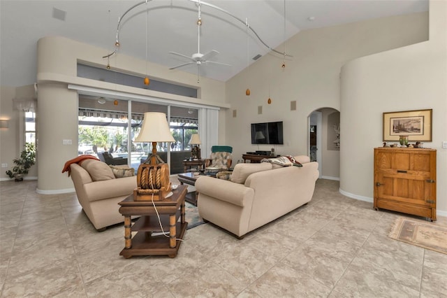 living room with ceiling fan, light tile patterned flooring, and high vaulted ceiling