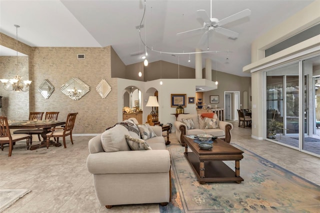 living room featuring ceiling fan with notable chandelier, light tile patterned floors, and high vaulted ceiling