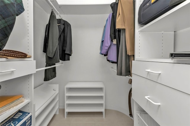 spacious closet with light tile patterned flooring