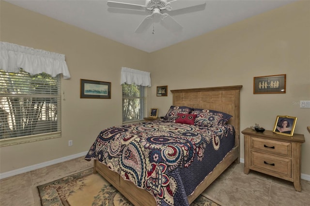 bedroom with ceiling fan and light tile patterned floors