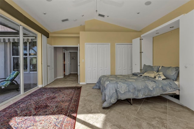 tiled bedroom with ceiling fan, access to exterior, multiple closets, and vaulted ceiling