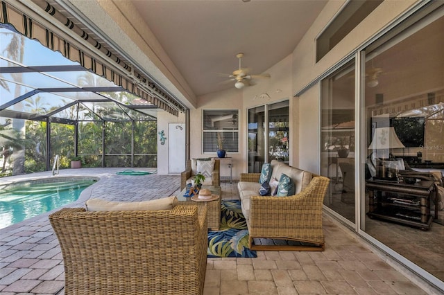 view of patio / terrace with ceiling fan, a lanai, and an outdoor living space