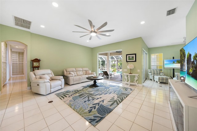 tiled living room featuring ceiling fan