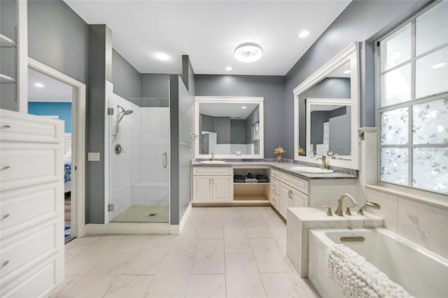 bathroom with plus walk in shower and vanity