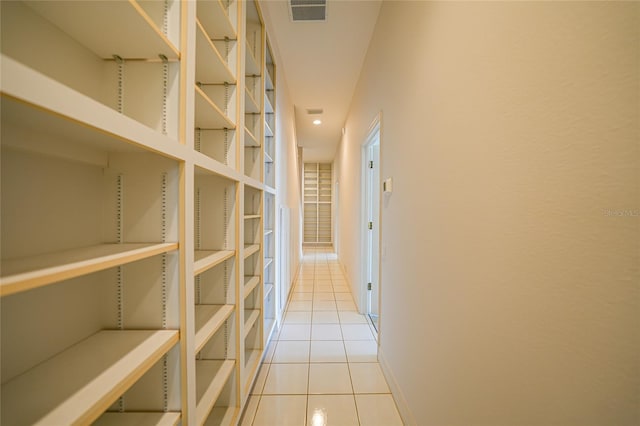 hall featuring light tile patterned floors