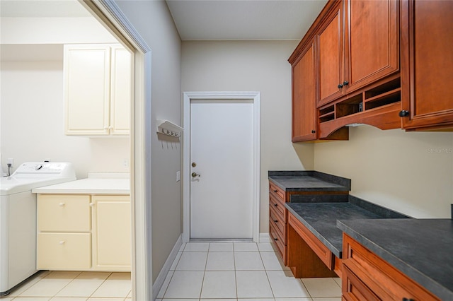 kitchen with washer / clothes dryer and light tile patterned floors