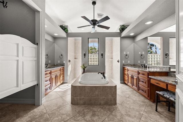 bathroom with vanity, ceiling fan, and a healthy amount of sunlight