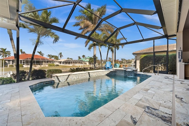 view of pool with a patio area and a lanai