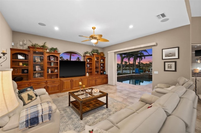 living room featuring ceiling fan