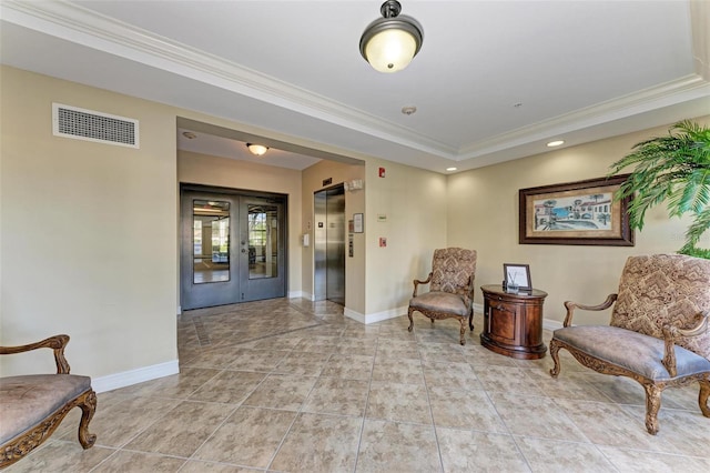 sitting room with french doors, elevator, ornamental molding, and light tile patterned flooring