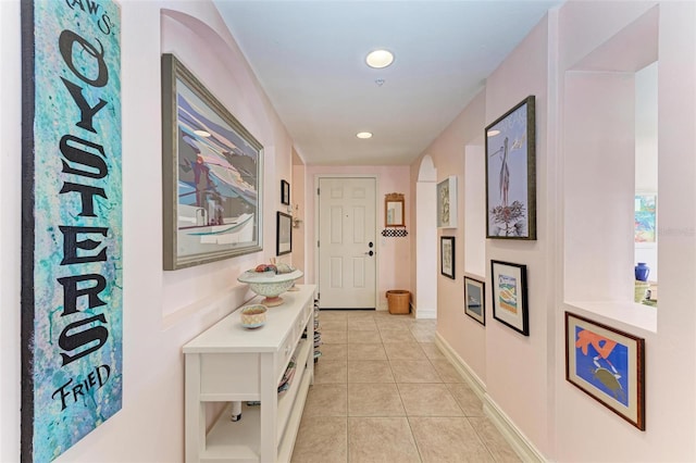 entryway with light tile patterned flooring