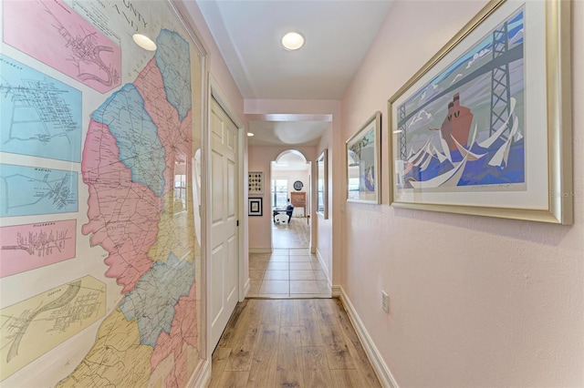 hallway with light hardwood / wood-style flooring