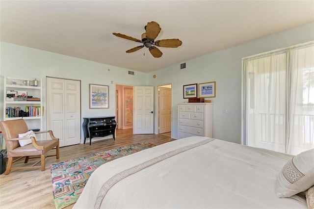 bedroom featuring a closet, ceiling fan, and light hardwood / wood-style flooring