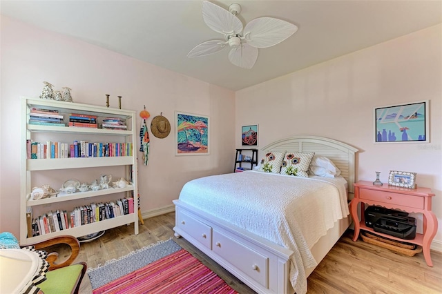 bedroom with ceiling fan and wood-type flooring