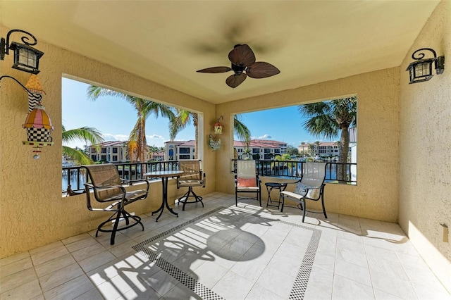 view of patio featuring ceiling fan