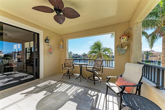 exterior space featuring a water view and ceiling fan