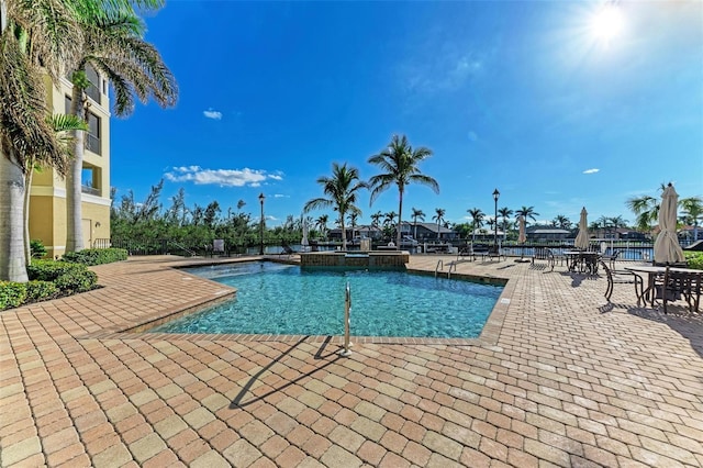 view of swimming pool with a patio area