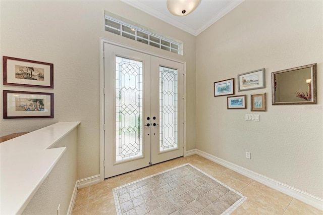 tiled foyer entrance featuring french doors and ornamental molding