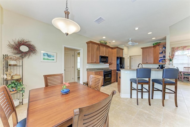 dining room featuring ceiling fan