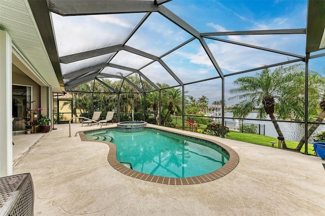 view of pool featuring a patio area, an in ground hot tub, a water view, and glass enclosure