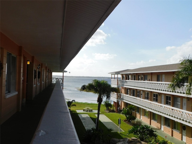 balcony featuring a water view