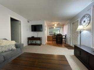 living room featuring light colored carpet