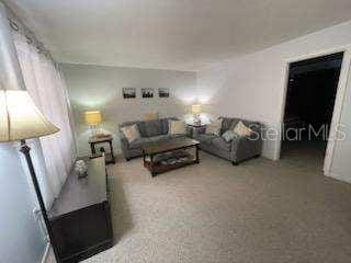 living room with carpet floors