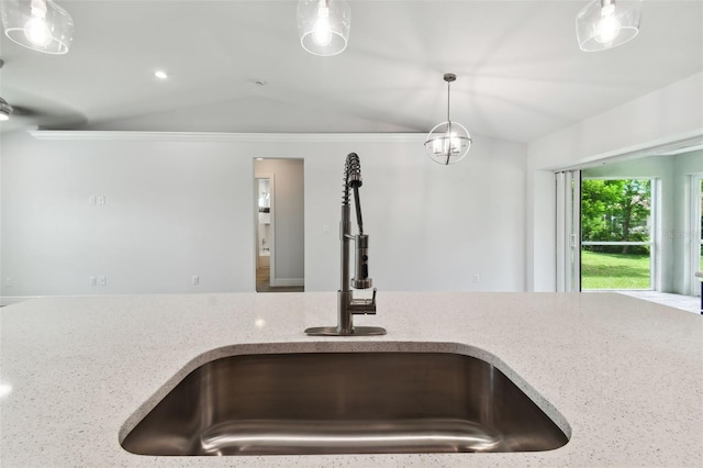 18854 Ackerman Ave, Port Charlotte, FL 33948 - kitchen view of light stone counters, pendant lighting, and crown molding