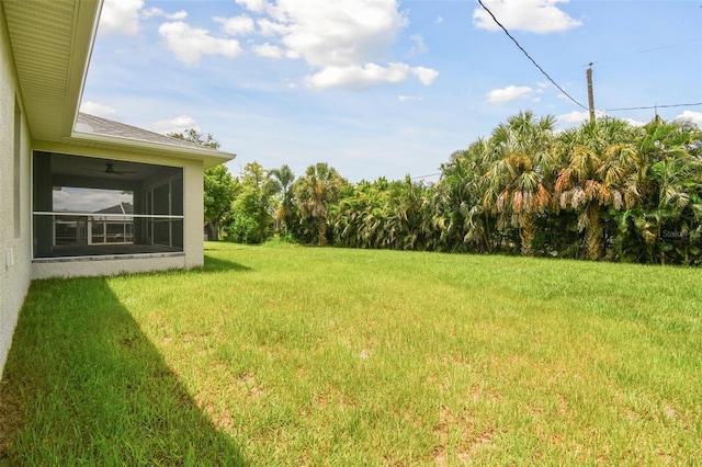 view of yard featuring a sunroom