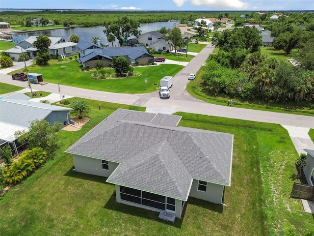 birds eye view of property featuring a water view