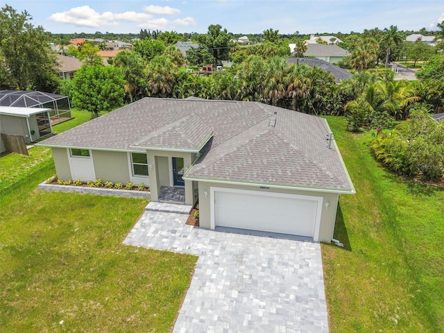 view of front of house featuring a front yard and a garage