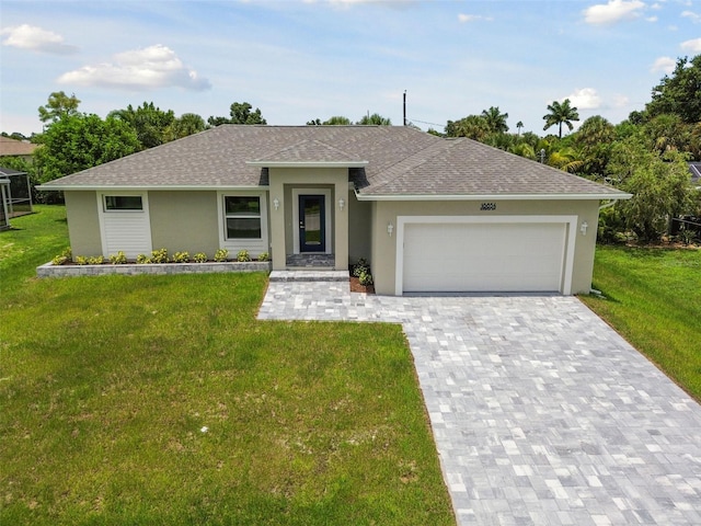 single story home with a garage and a front lawn