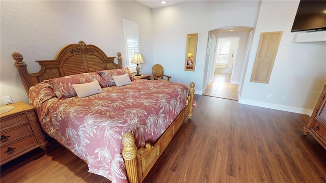 bedroom featuring dark hardwood / wood-style floors