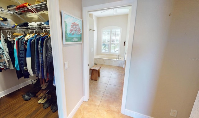 walk in closet featuring light tile patterned floors